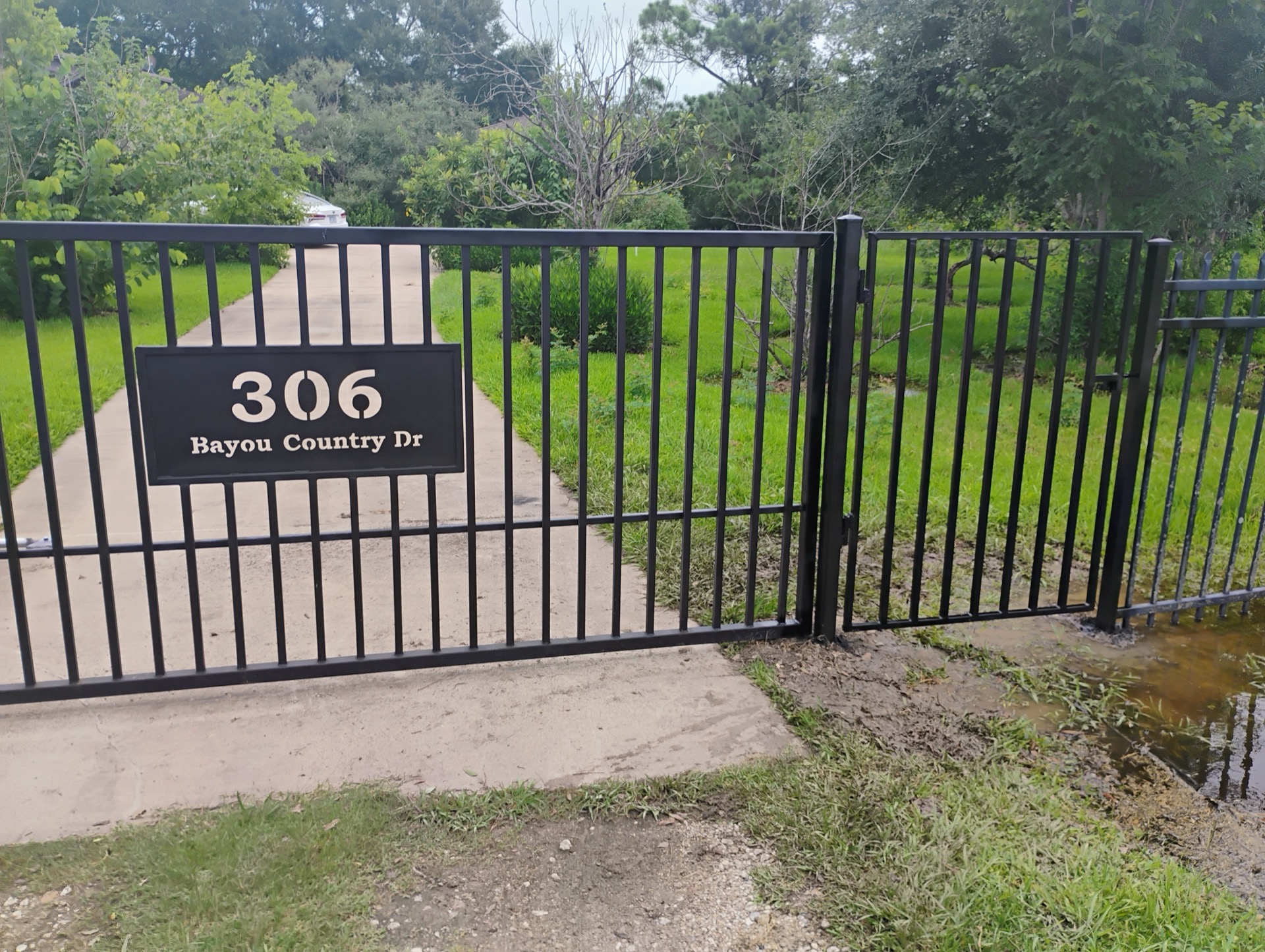 Custom driveway gate Bayou Country style