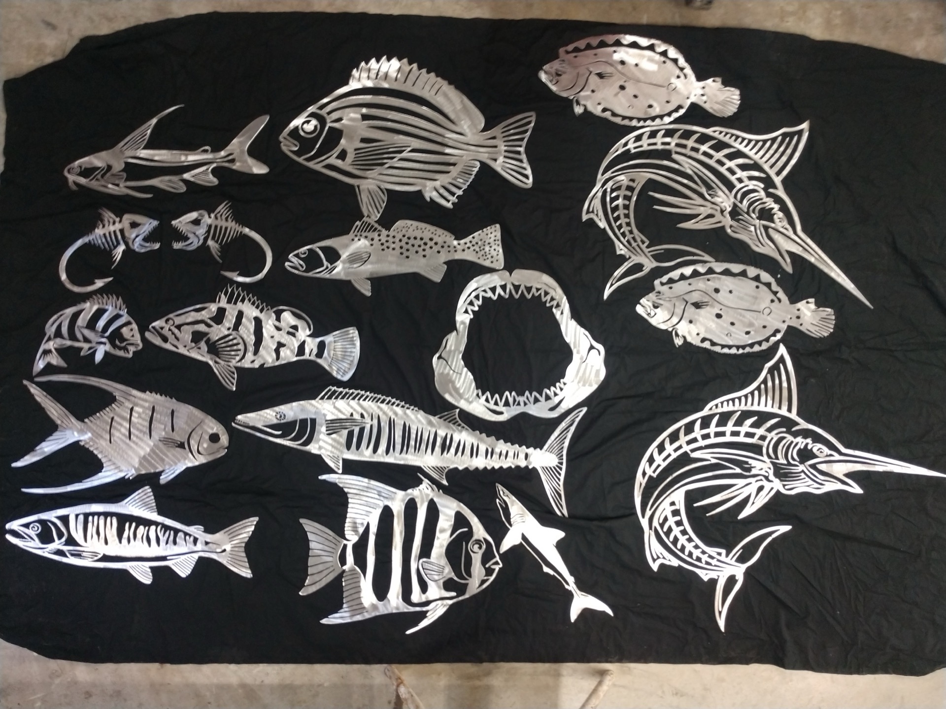 Collection of metal fish wall art